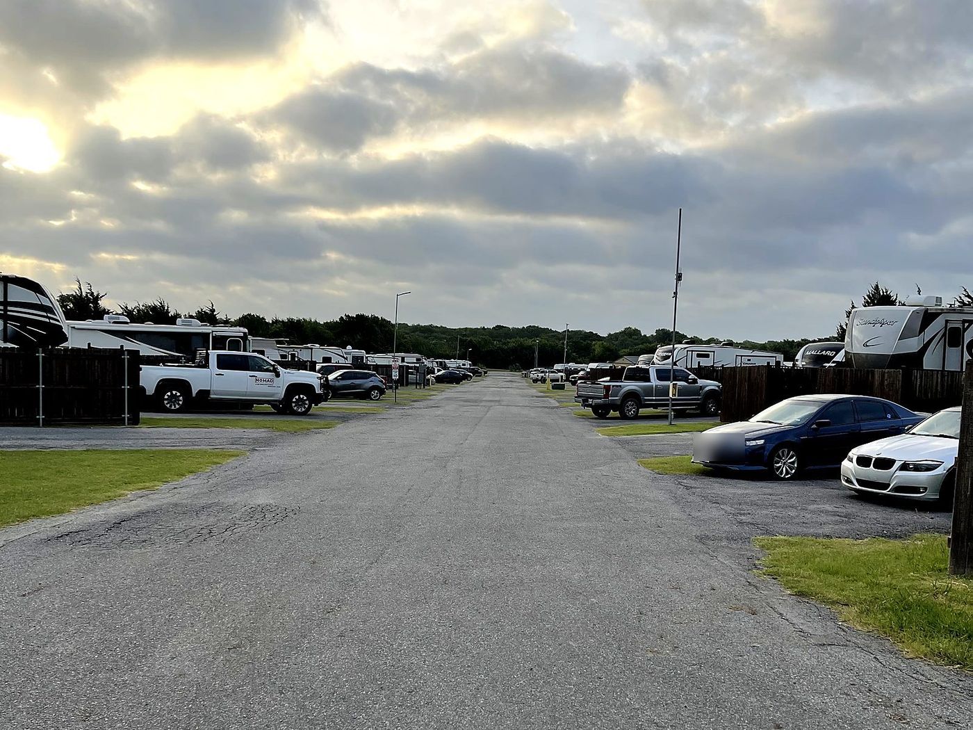 The main drive through Blue Ridge RV Park at sunset, rigs parked on both sides